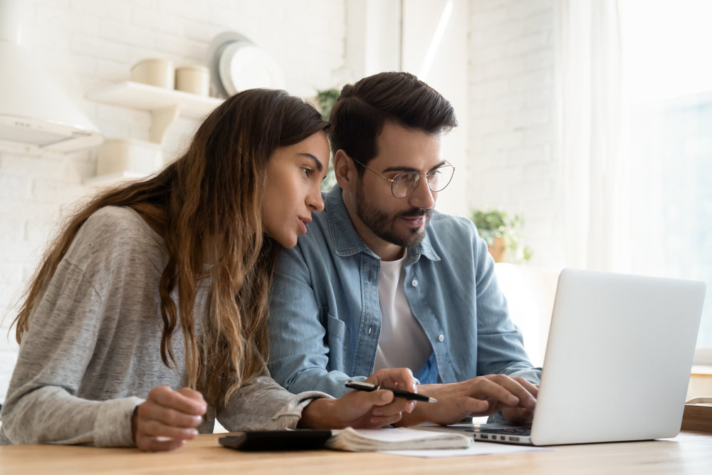 Focused young couple looking for tenants for rental property