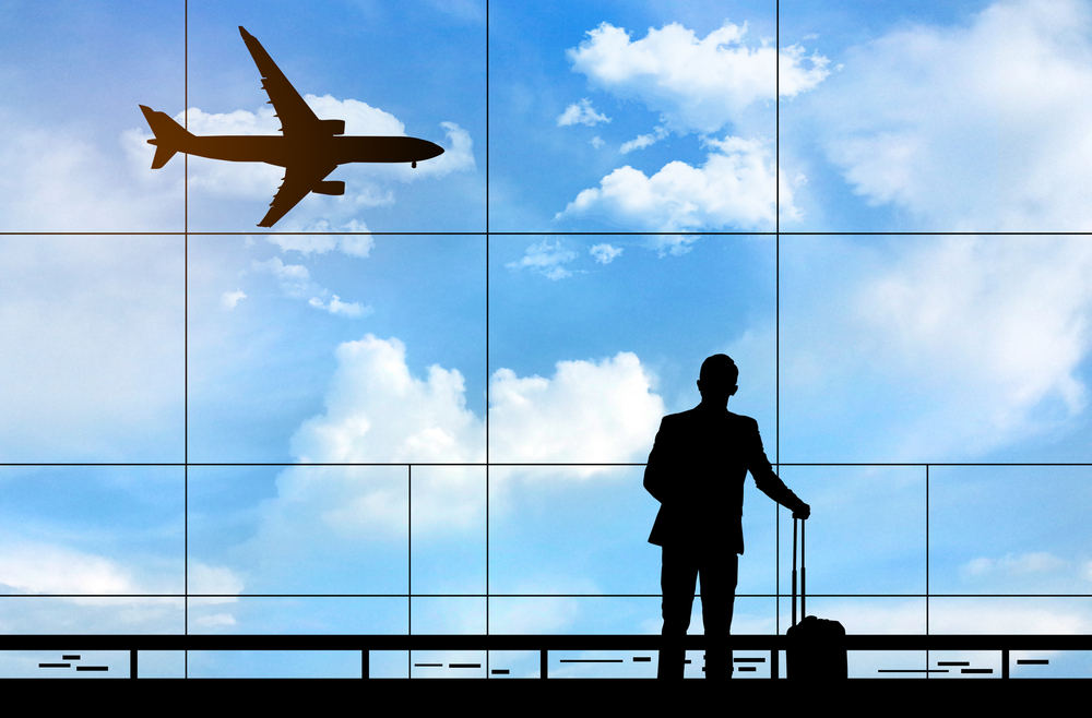 Silhuette of Business man traveling (Turn Your Vacation into a Tax-Deductible Business Travel)