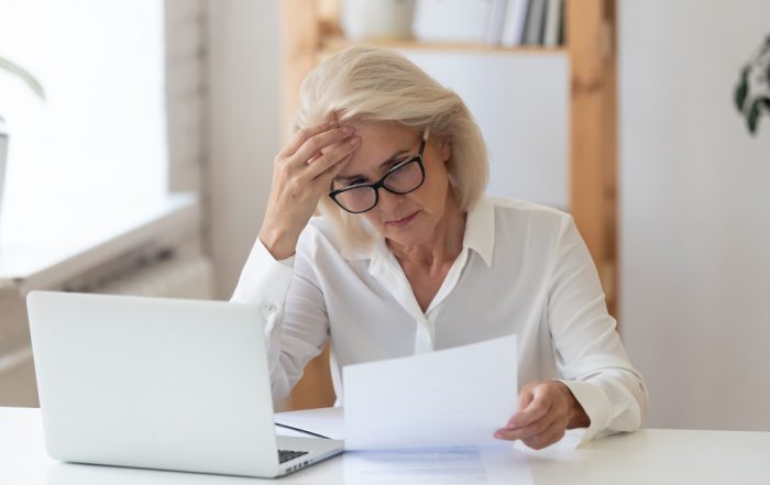 Lady stressed by filing his taxes late (Big Mistake Filing Your Tax Return Late)
